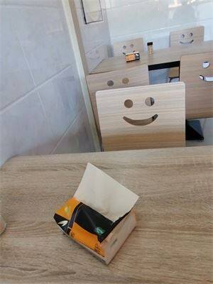 Restaurant pulling facial tissue