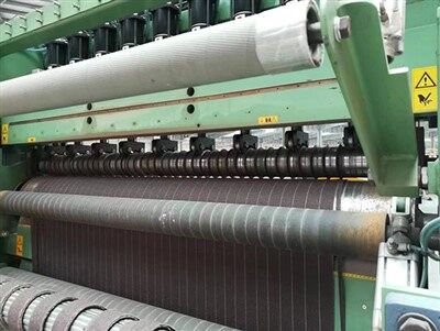 Leveä hankauskangashihnan leikkauskone