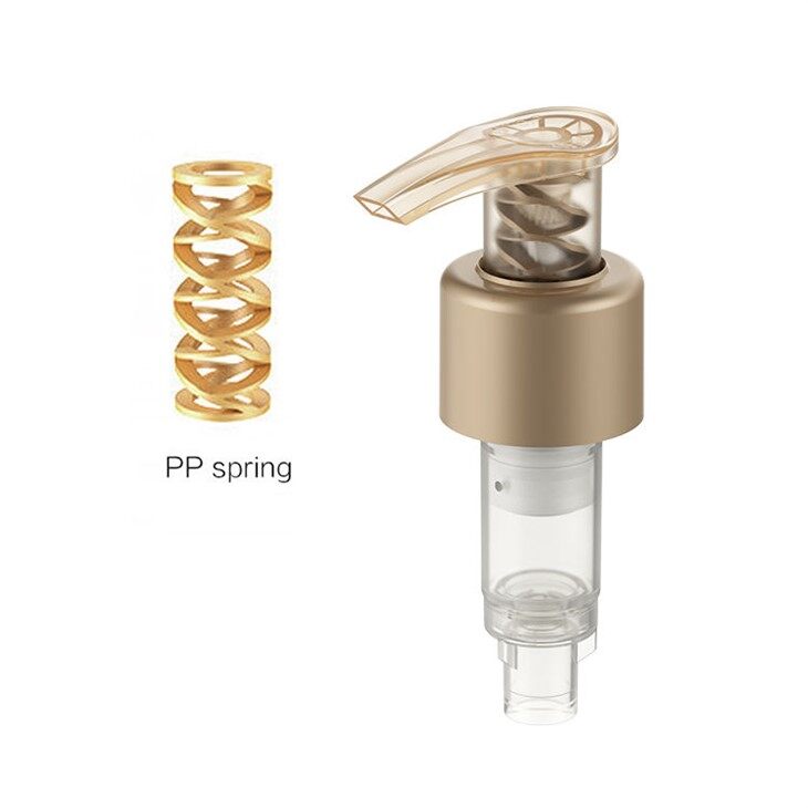 Close-up detail of premium gold recyclable pump and its isolated yellow plastic spring mechanism