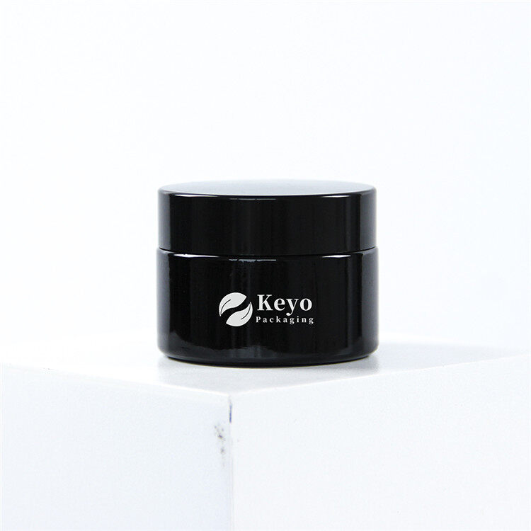 Melnas kosmētikas burkas