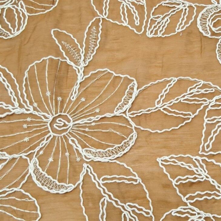 Teixit brodat de niló de tencel